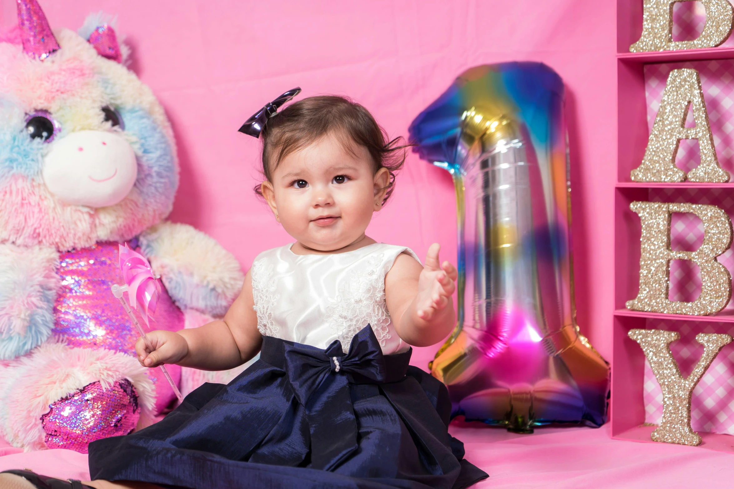 a baby girl sitting next to a stuffed unicorn, a portrait, pexels, party balloons, portrait image, various posed, pink and blue colour