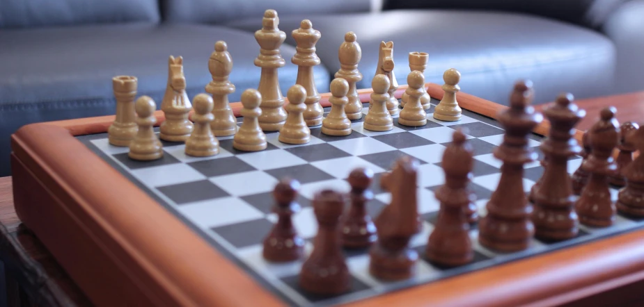 a close up of a chess board on a table, by Carey Morris, pexels contest winner, hyperrealism, on a wooden tray, thumbnail, casual game, zoomed in shots