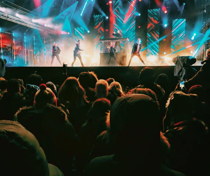 a group of people standing on top of a stage, popular on instagram, dazzling lights, backstreet boys, overexposed photograph