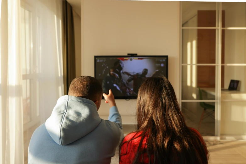 a man and a woman sitting in front of a tv, action game, kids playing, anton fadeev 8 k, instagram picture