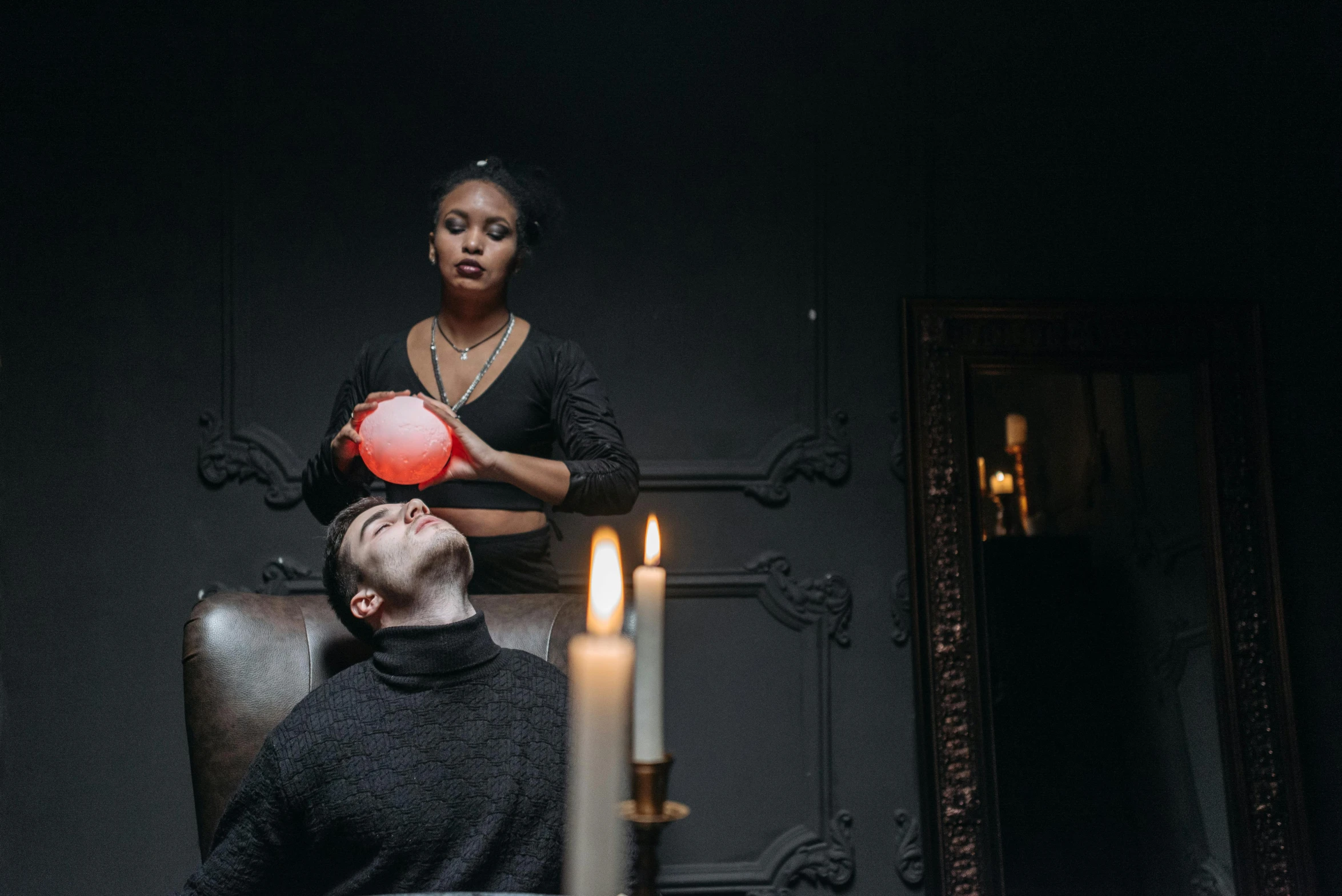 a man sitting on top of a chair next to a woman, casting spells, creepy lighting, profile image, potions