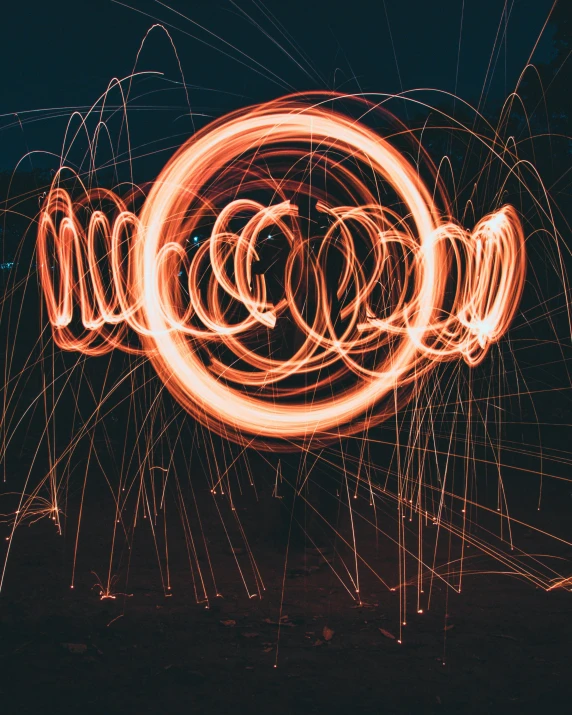 a long exposure photograph of a light painting, pexels contest winner, coloured in orange fire, instagram post, ring light, fireworks in the background