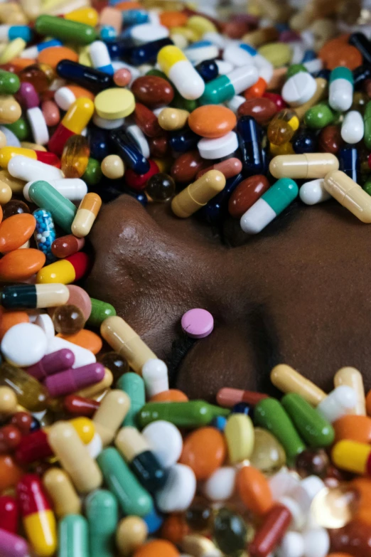 a close up of a doughnut covered in sprinkles, an album cover, by artist, pills and medicine, photo of a black woman, photograph credit: ap, taking mind altering drugs