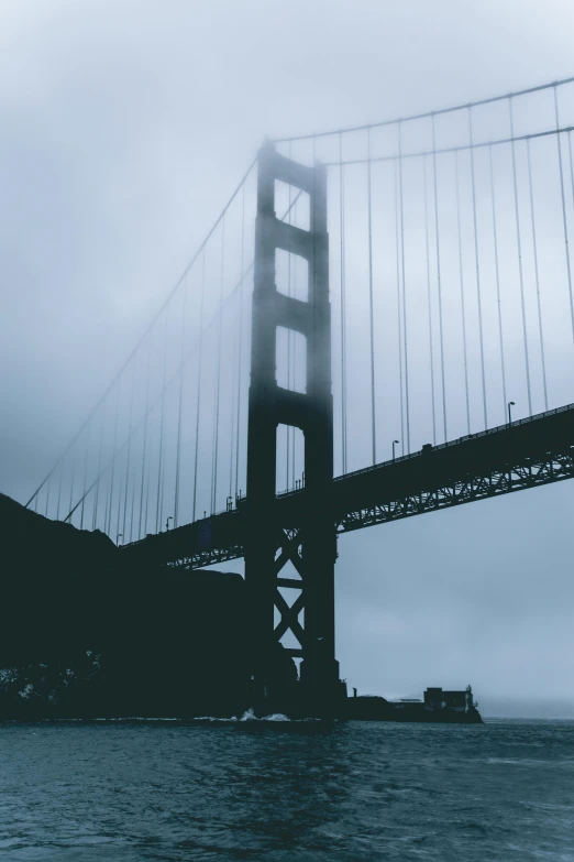 a black and white photo of the golden gate bridge, pexels contest winner, modernism, foggy dark, desaturated color, silhouetted, large)}]