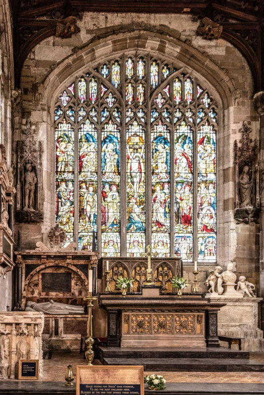 the interior of a church with a stained glass window, by Edward Clark, renaissance, intricate stone carvings, warwick saint, cathedral background, multicoloured