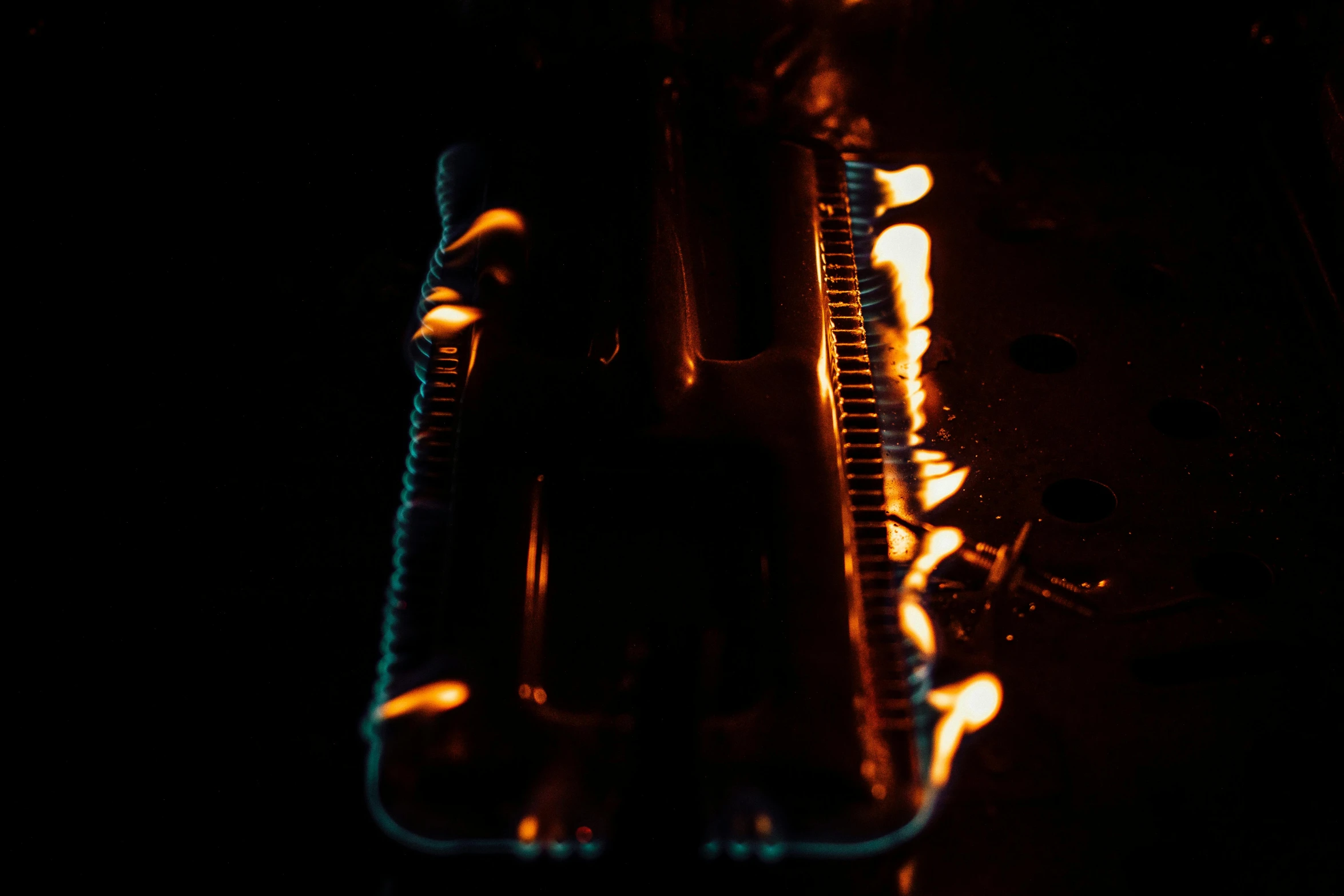 a close up of a guitar in the dark, geforce rtx 3090 on fire, photography ultrafine detail, hot glue, instagram picture