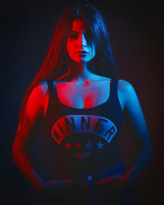 a woman with long hair wearing a tank top, an album cover, inspired by Elsa Bleda, pexels contest winner, red and blue black light, portrait demi rose, cinematic outfit photo, black shirt with red star