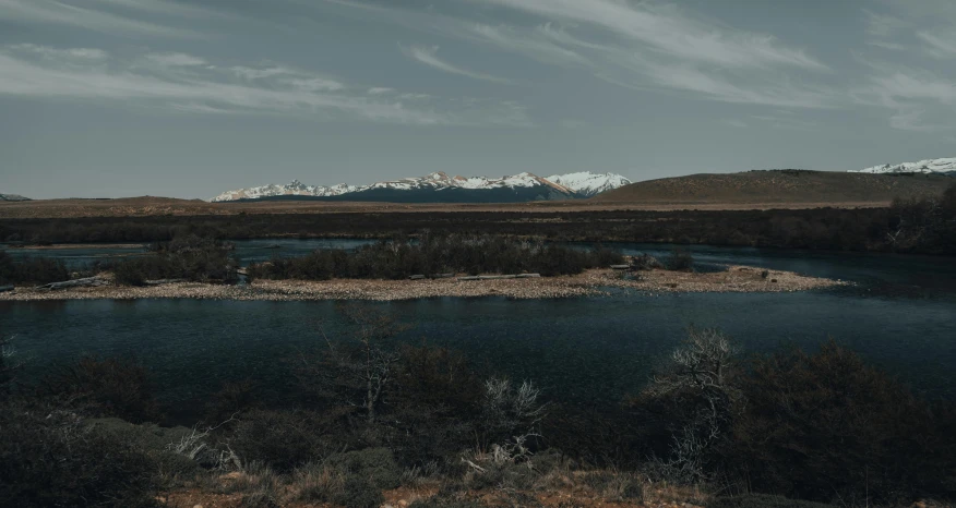 a body of water with mountains in the background, by Pablo Rey, unsplash contest winner, hurufiyya, panoramic anamorphic, mountains river trees, desolate landscape, computer wallpaper