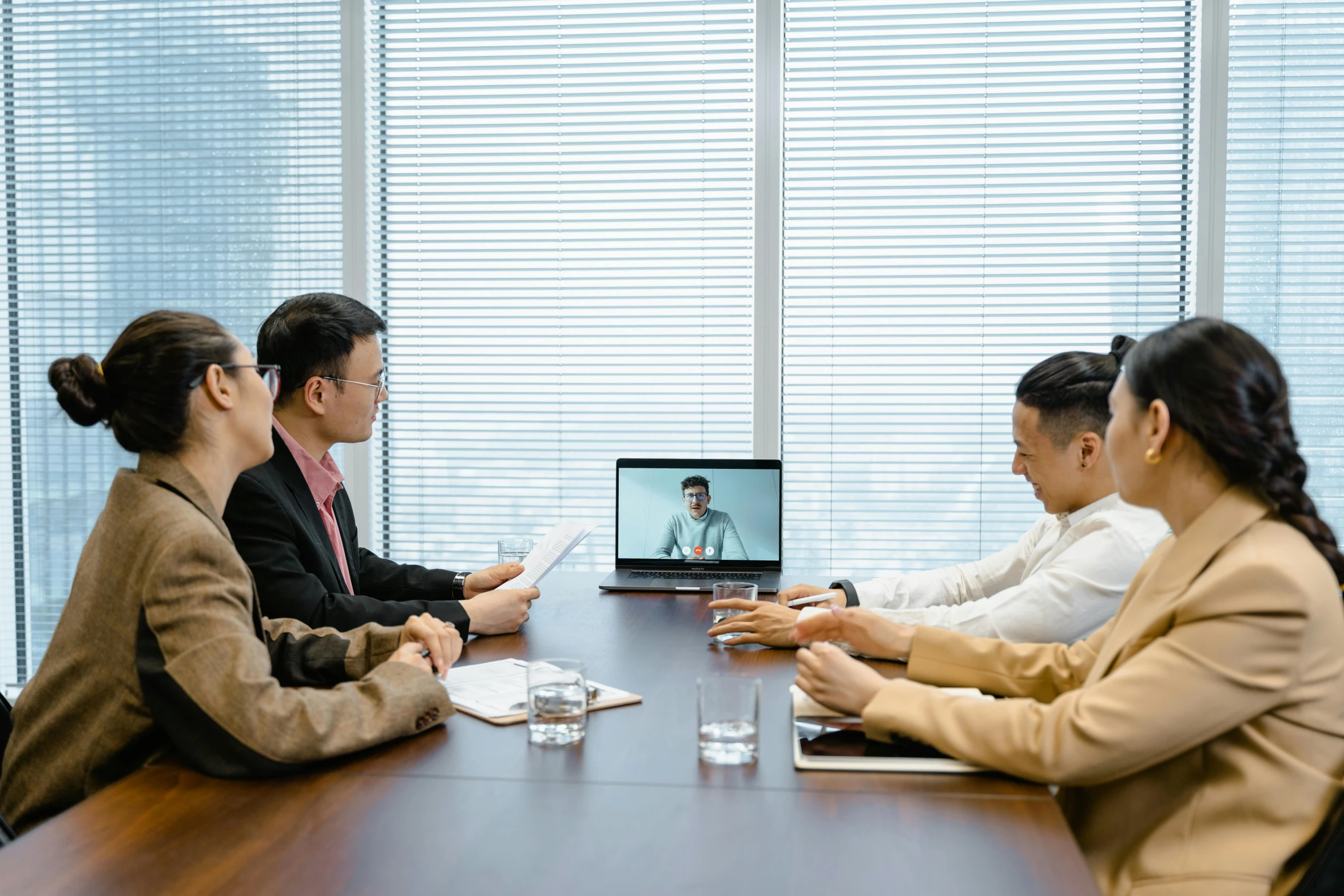 a group of people sitting around a conference table, pexels contest winner, virtual installation, japanese, fan favorite, digital medical equipment