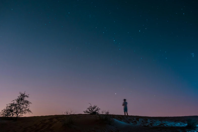 a person standing on top of a hill under a sky full of stars, pexels contest winner, in the australian desert, faded glow, instagram post, cloudless sky