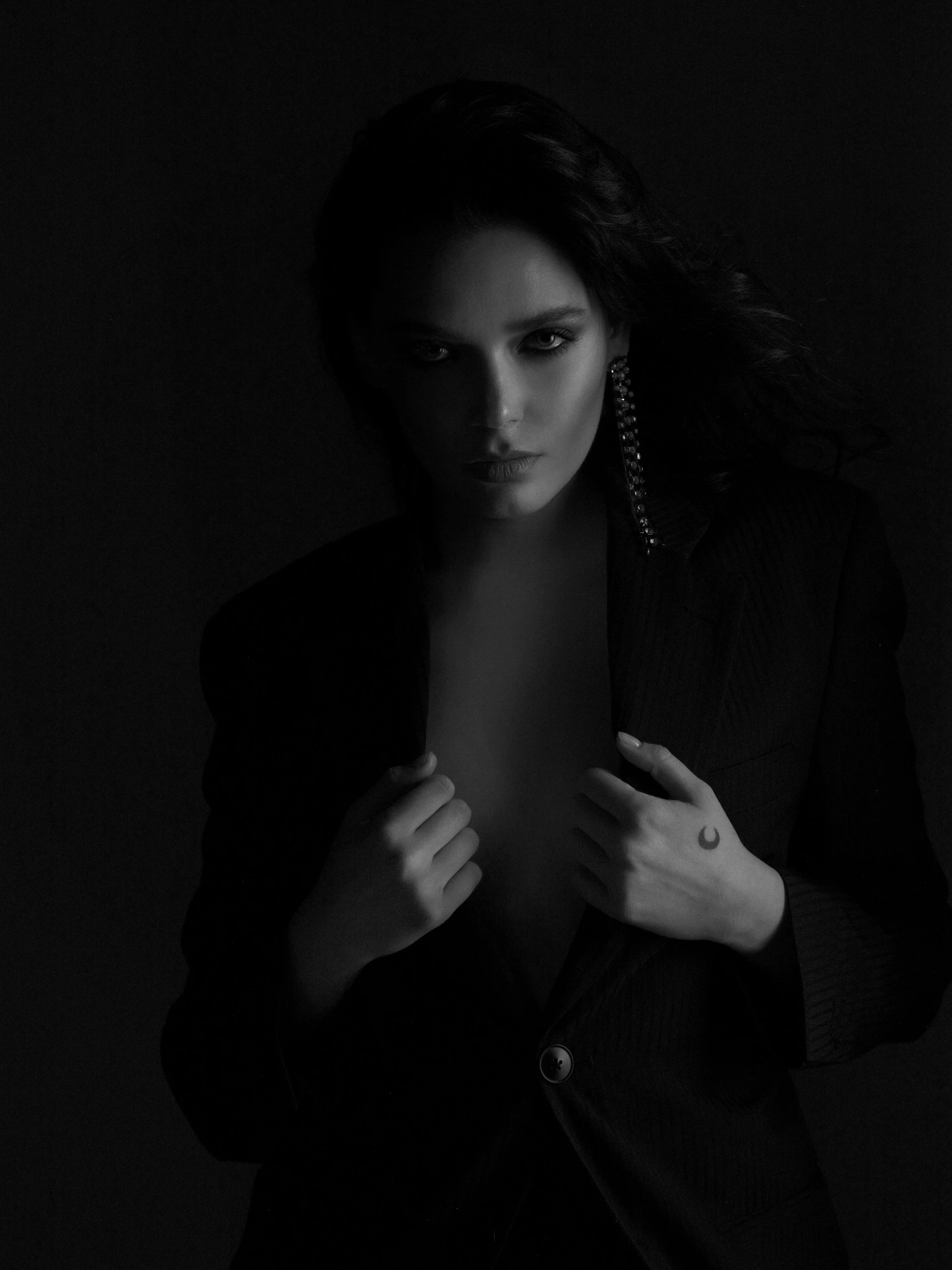 a black and white photo of a woman in a suit, unsplash, conceptual art, nina dobrev, album cover, young sensual woman, studio medium format photograph