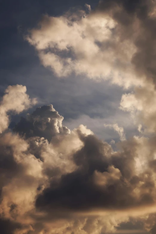 a plane is flying through a cloudy sky, a portrait, unsplash, layered stratocumulus clouds, dramatic ”, ignant, dramatic lighting - n 9