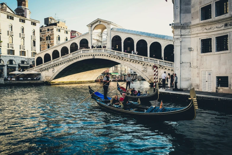 a gondola on a river with a bridge in the background, by Carey Morris, pexels contest winner, renaissance, white sweeping arches, group photo, slightly pixelated, 🦩🪐🐞👩🏻🦳