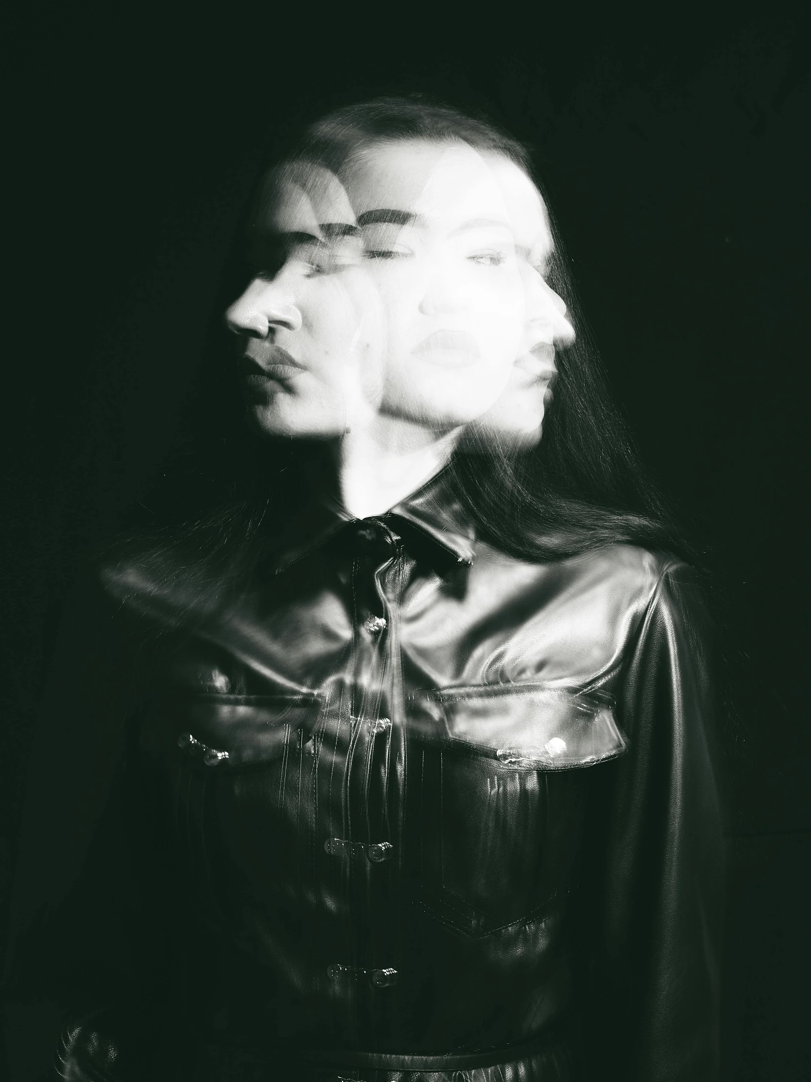 a black and white photo of a man with long hair, inspired by Anna Füssli, unsplash, surrealism, she wears leather jacket, transparent face, bella poarch, both faces visible