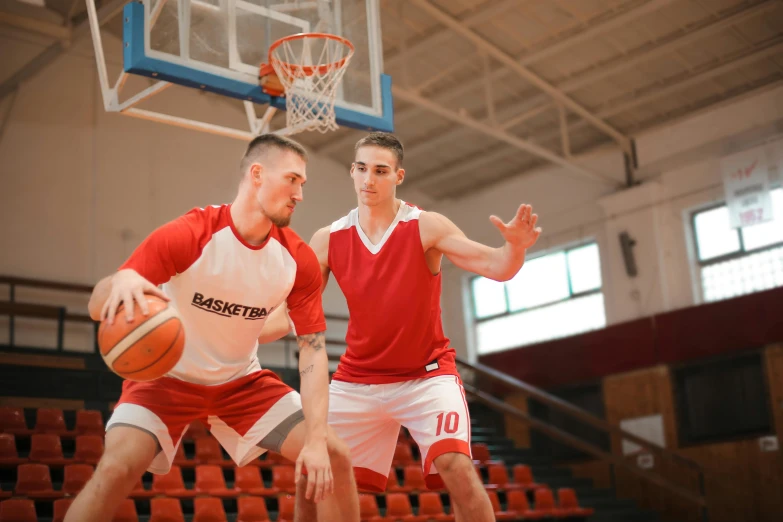 a couple of men playing a game of basketball, trending on dribble, red sport clothing, 15081959 21121991 01012000 4k, college, kilian eng and jake parker