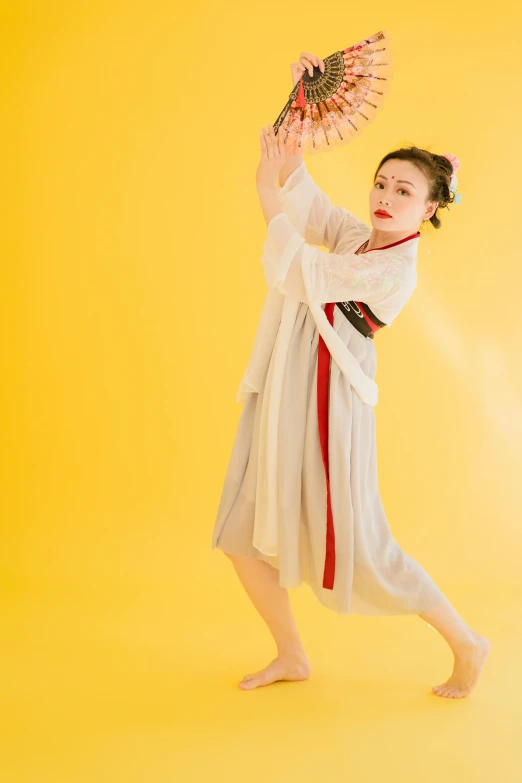 a woman in a white dress holding a fan, an album cover, inspired by Tang Di, dynamic moving pose, けもの, 8 k )