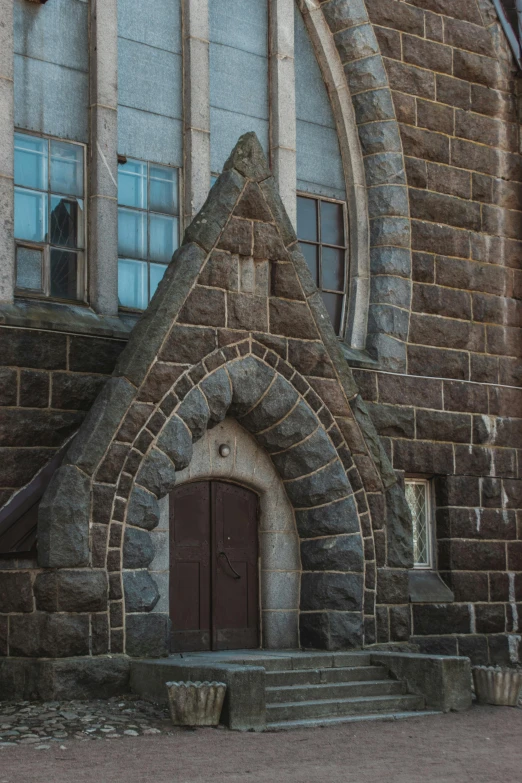 a red fire hydrant sitting in front of a church, an album cover, inspired by Sydney Prior Hall, unsplash, romanesque, arched doorway, brown, made of stone and concrete, reykjavik junior college