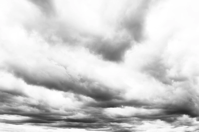 a black and white photo of a cloudy sky, on a white background, mundane, menacing atmosphere, fine art print