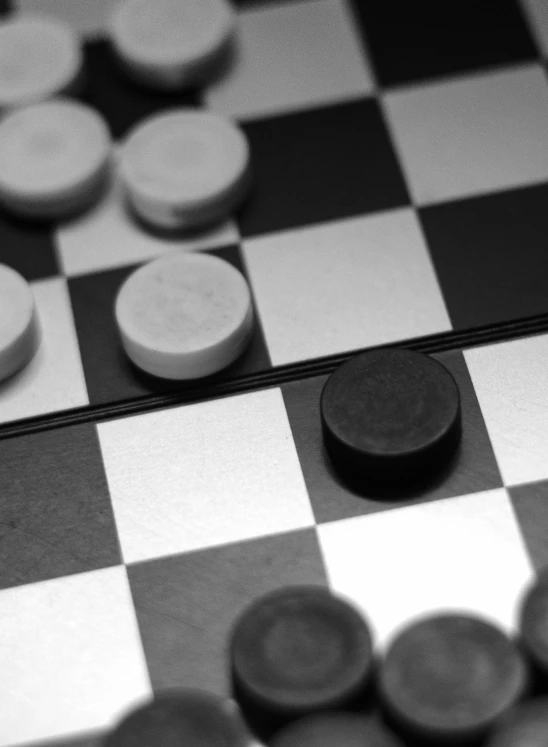 several different pieces of furniture sitting on a checkered chessboard