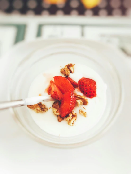 a bowl of yogurt with strawberries and granola, pexels contest winner, renaissance, smooth tiny details, instagram story, thc, spoon placed