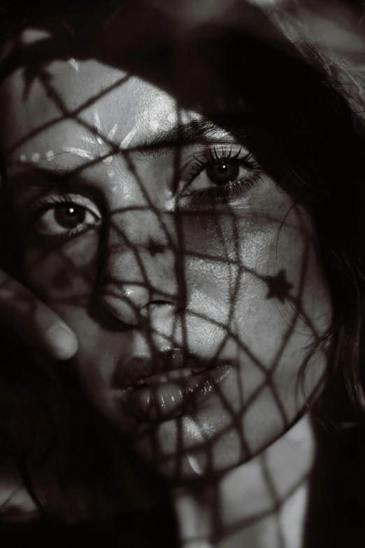 a woman with a veil covering her face, a black and white photo, inspired by Elsa Bleda, pexels contest winner, surrealism, fishnet, portrait of ana de armas, face with scars, petra collins and mc. escher