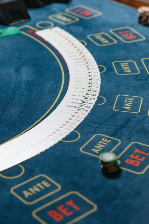 a blackjacker table at a casino, an album cover, unsplash, superflat, fabric embroidery, blue color grading, round-cropped, overview