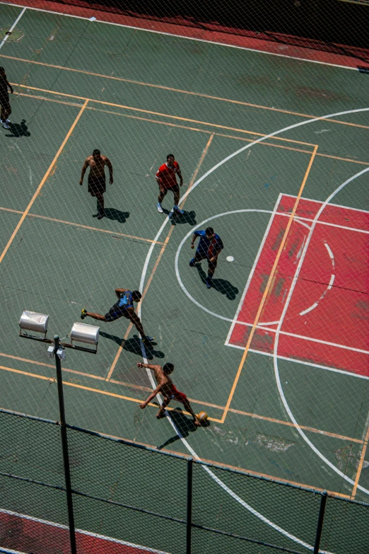 a group of people playing a game of basketball, by Matt Stewart, trending on dribble, arial shot, sao paulo, 15081959 21121991 01012000 4k, square