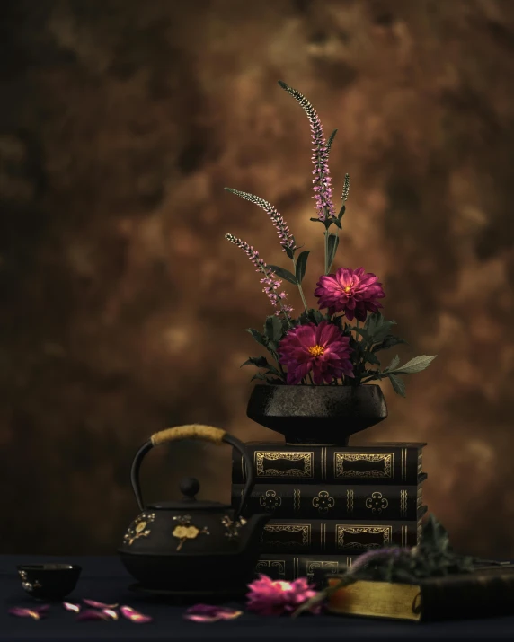 a vase of flowers sitting on top of a stack of books, a still life, inspired by Kanō Hōgai, pexels contest winner, brown and magenta color scheme, dark and intricate photograph, render 8k, herbs and flowers