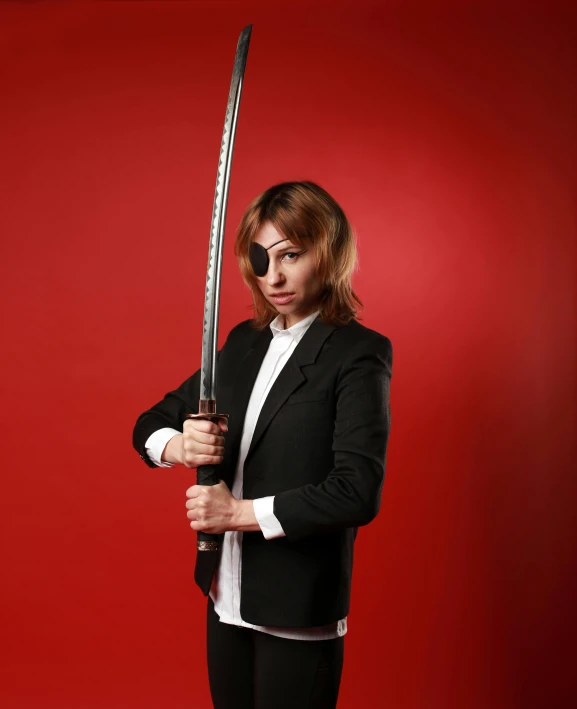 a woman in a suit holding a sword, an album cover, inspired by Kanō Sanraku, unsplash, non-binary, tanjiro kamado, commercial photo, menacing look