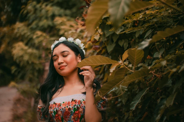 a woman in a floral dress holding a leaf, inspired by Fernando Amorsolo, pexels contest winner, aestheticism, wearing a headband, avatar image, instagram picture, profile pic