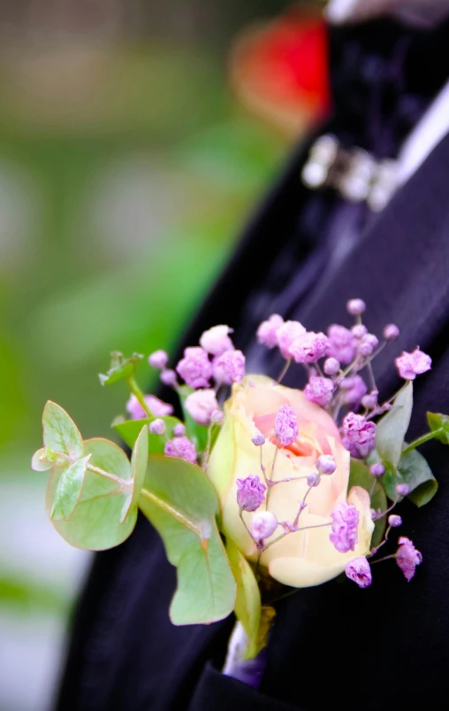 a close up of a person in a suit with a flower on his lapel, 15081959 21121991 01012000 4k, lush surroundings, pale pastel colours, event photography