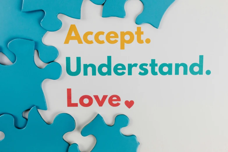 a puzzle piece with the words accept understand love, inspired by Milton Glaser, panel, thumbnail, schools, multi-part