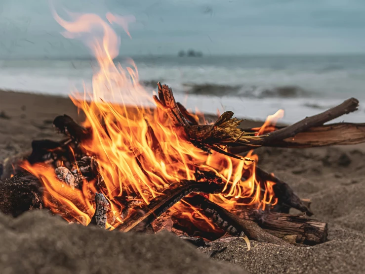 a close up of a fire on a beach, pexels contest winner, renaissance, thumbnail, al fresco, instagram post, background image