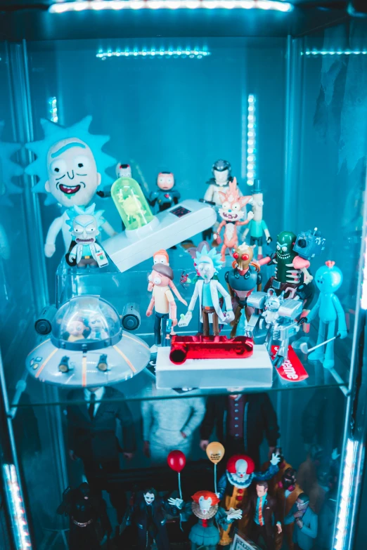 a collection of toy figurines in a glass case, a hologram, unsplash, maximalism, rick sanchez in real life, tara mcpherson, high quality photo, killua zoldyck made of jewlery