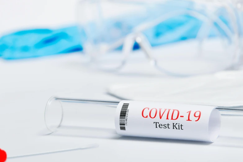 a test kit sitting on top of a table, a picture, by Matt Cavotta, shutterstock, coronavirus, background is white, 1 6 x 1 6, 1 9 th