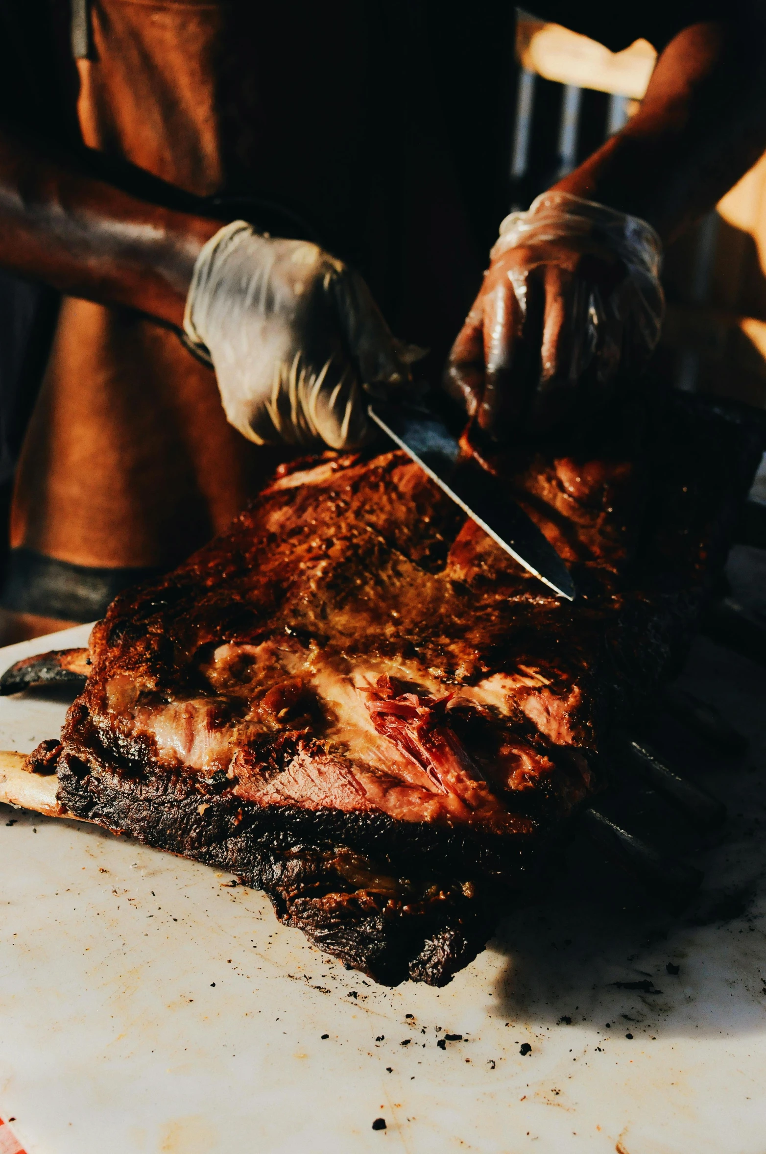 a person cutting a large piece of meat on a cutting board, black man, thumbnail, festivals, 2019 trending photo