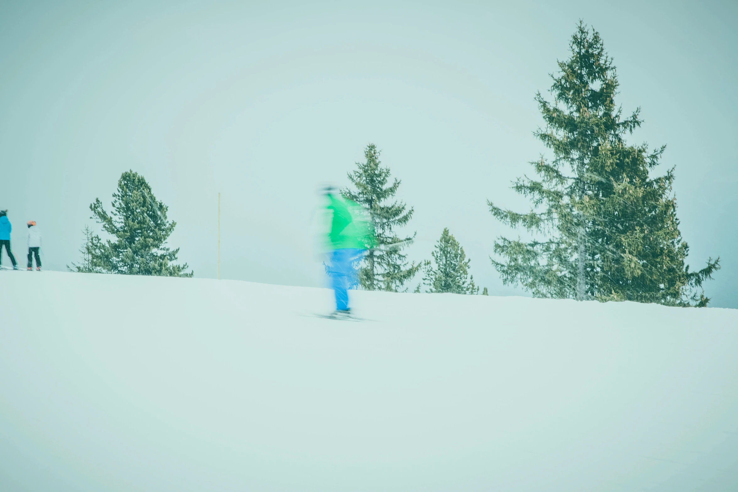 a couple of people riding skis down a snow covered slope, a picture, pexels contest winner, figuration libre, tones of blue and green, snowstorm ::5, faded effect, evergreen