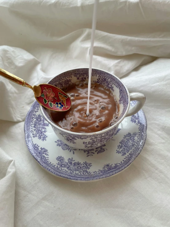 a person pouring milk into a cup of hot chocolate, inspired by Henriette Grindat, lavender, gif, olivia kemp, highly detailed melted wax