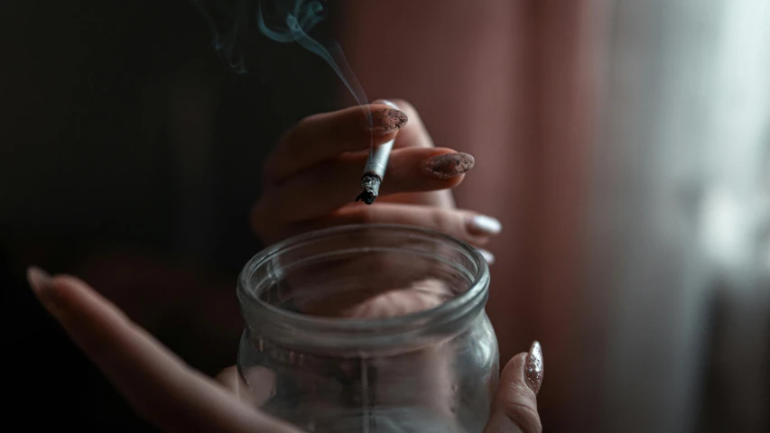 a person smoking a cigarette in a glass jar, inspired by Elsa Bleda, pexels contest winner, sleek hands, some mist grey smoke and fire, pot, fanart