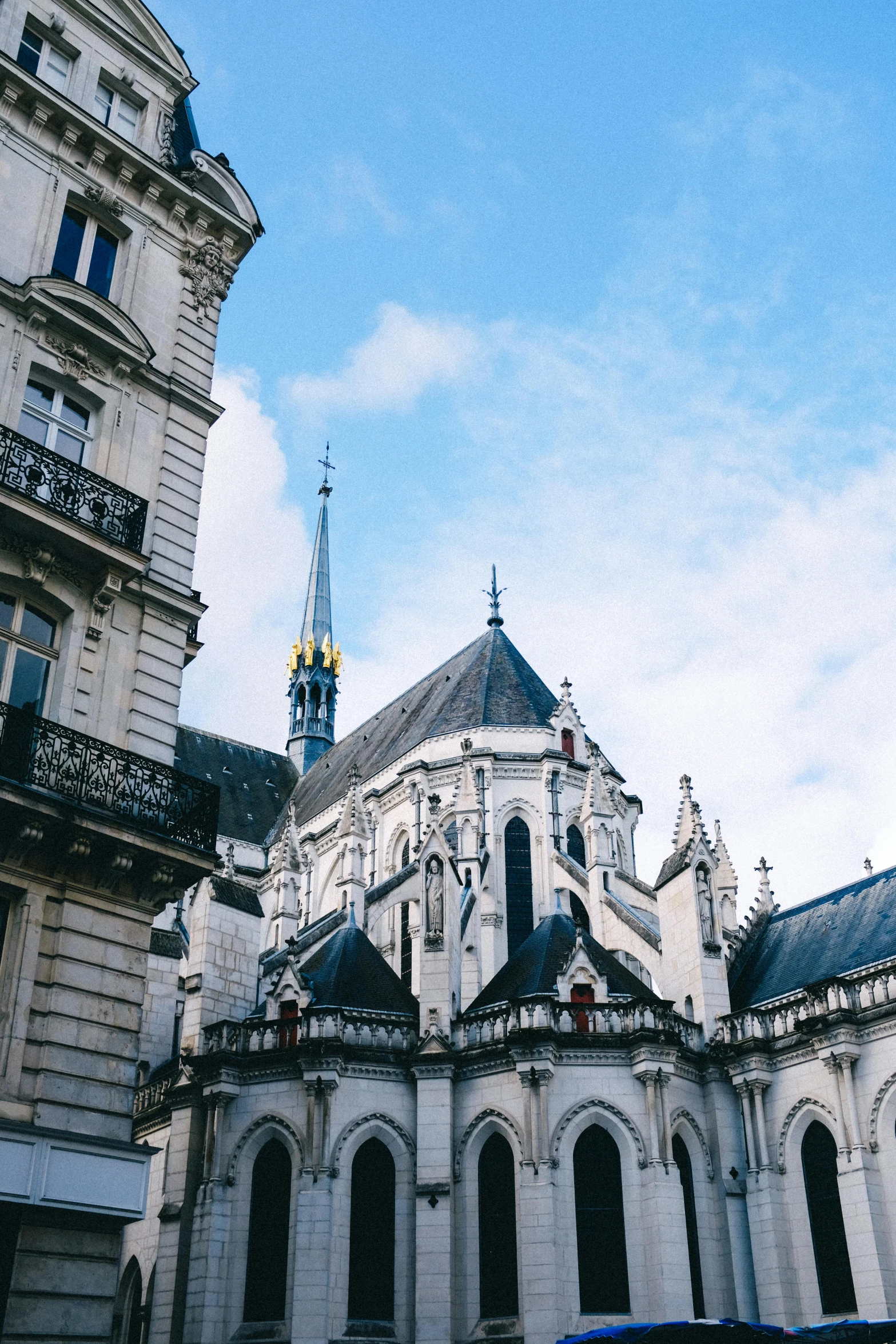 a car that is parked in front of a building, a photo, trending on unsplash, paris school, black domes and spires, white church background, view from bottom, square
