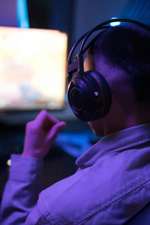 a person wearing headphones in front of a tv, computer game, tournament, zoomed in, 2 5 6 x 2 5 6 pixels