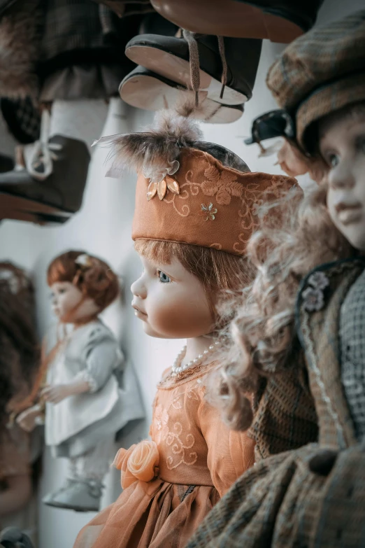 a group of dolls sitting next to each other, by Ivana Kobilca, rococo, white and orange, vintage muted colors, slide show, up close