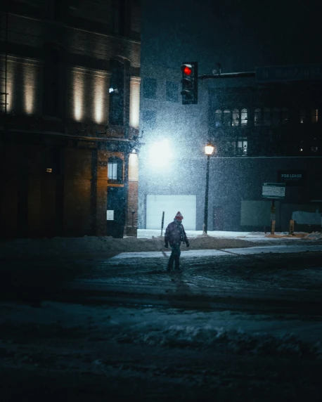 a person walking across a snow covered street at night, bisexual lighting, portrait featured on unsplash, downtown, multiple stories