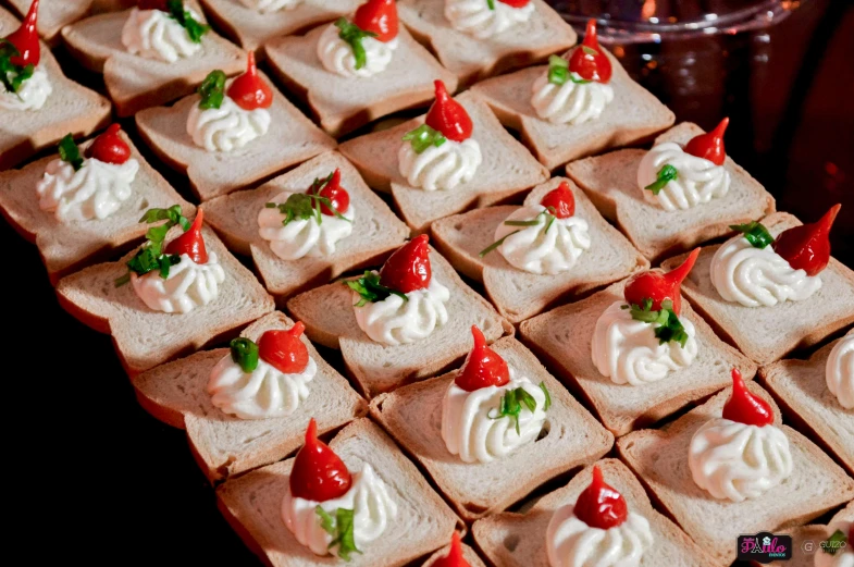 a close up of a tray of food on a table, braavos, red and white, square, parties