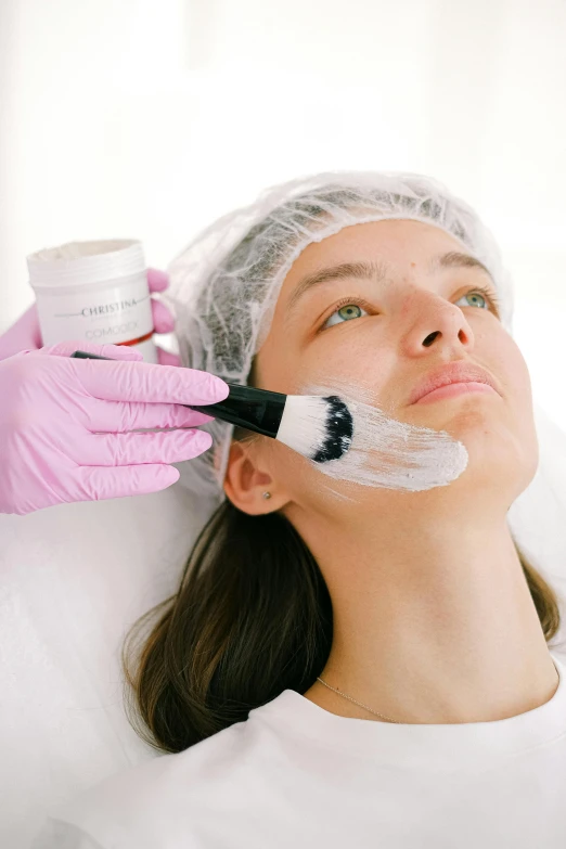 a woman getting a facial mask at a beauty salon, by Évariste Vital Luminais, ultra texture, thumbnail, anaesthetic, white cheeks