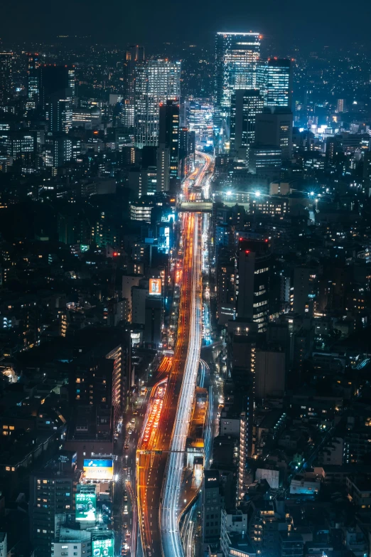 an aerial view of a city at night, a picture, inspired by Kanō Naizen, unsplash contest winner, traffic, narrow, skyline, nightlife