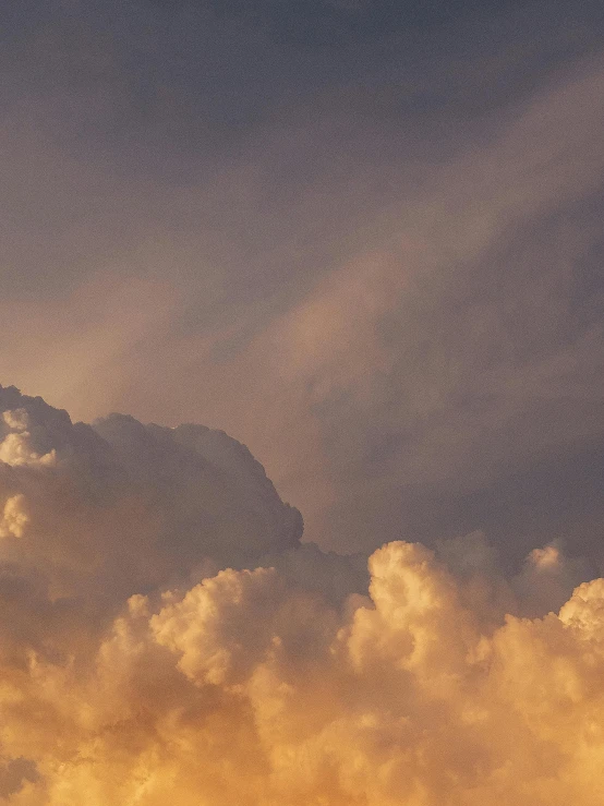 a jetliner flying through a cloudy sky, by Carey Morris, pexels contest winner, romanticism, golden hour closeup photo, cotton candy clouds, today\'s featured photograph 4k, grey