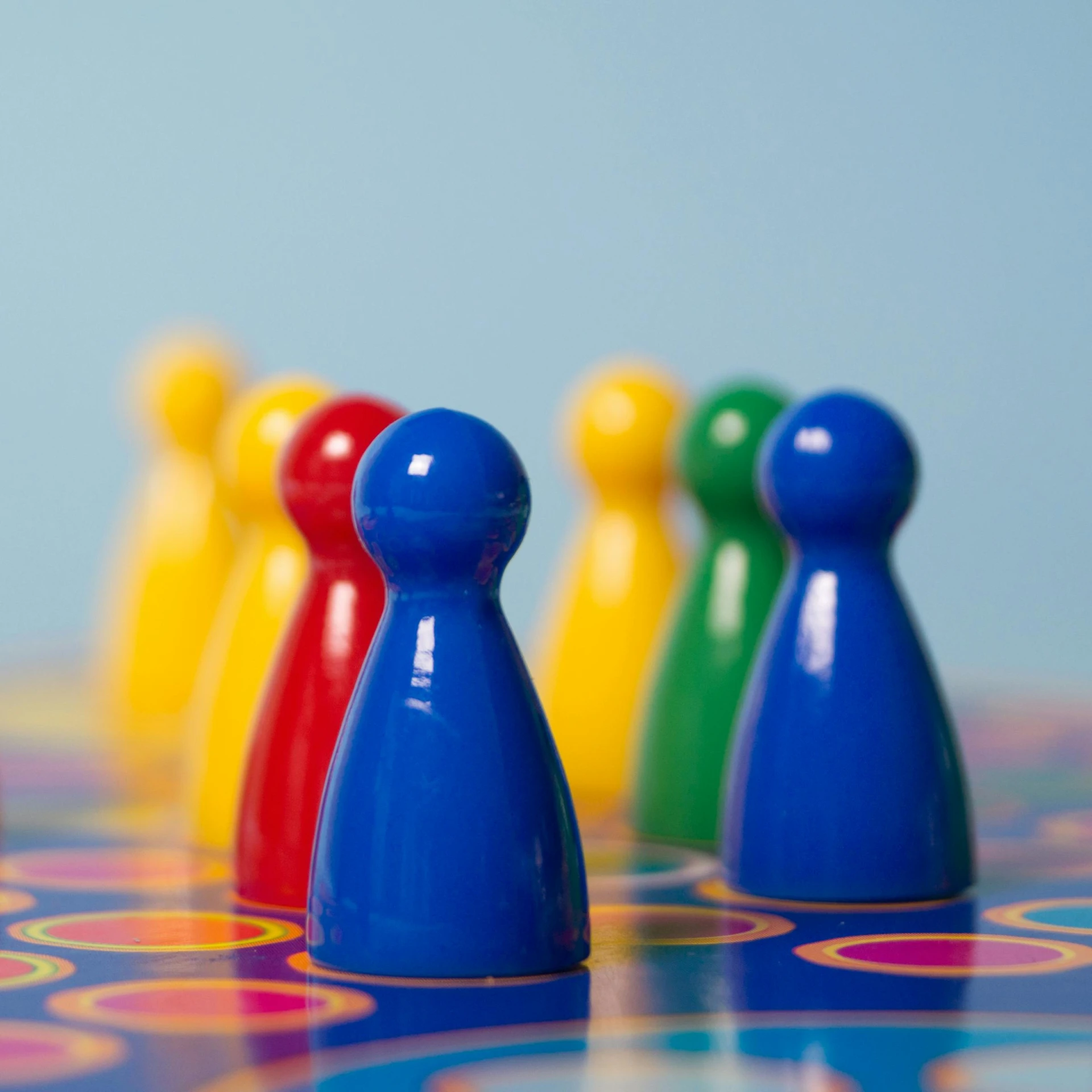 a group of game pieces sitting on top of a table, by Juan O'Gorman, pexels, figuration libre, red yellow blue, close-up product photo, blue colours, standing straight