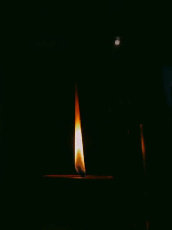 a close up of a lit candle in the dark, an album cover, inspired by Elsa Bleda, instagram post, profile image, playing with fire, black magic