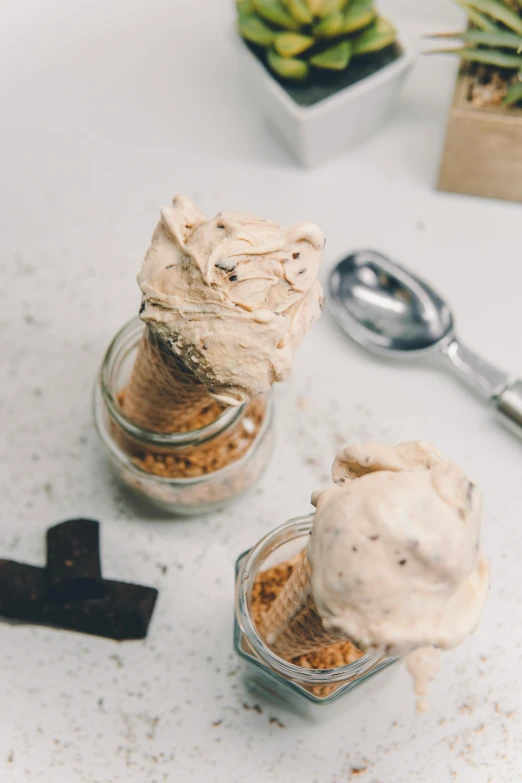 a couple of small jars filled with ice cream, unsplash, renaissance, deconstructed waffle, thumbnail, detailed product shot, mid shot photo